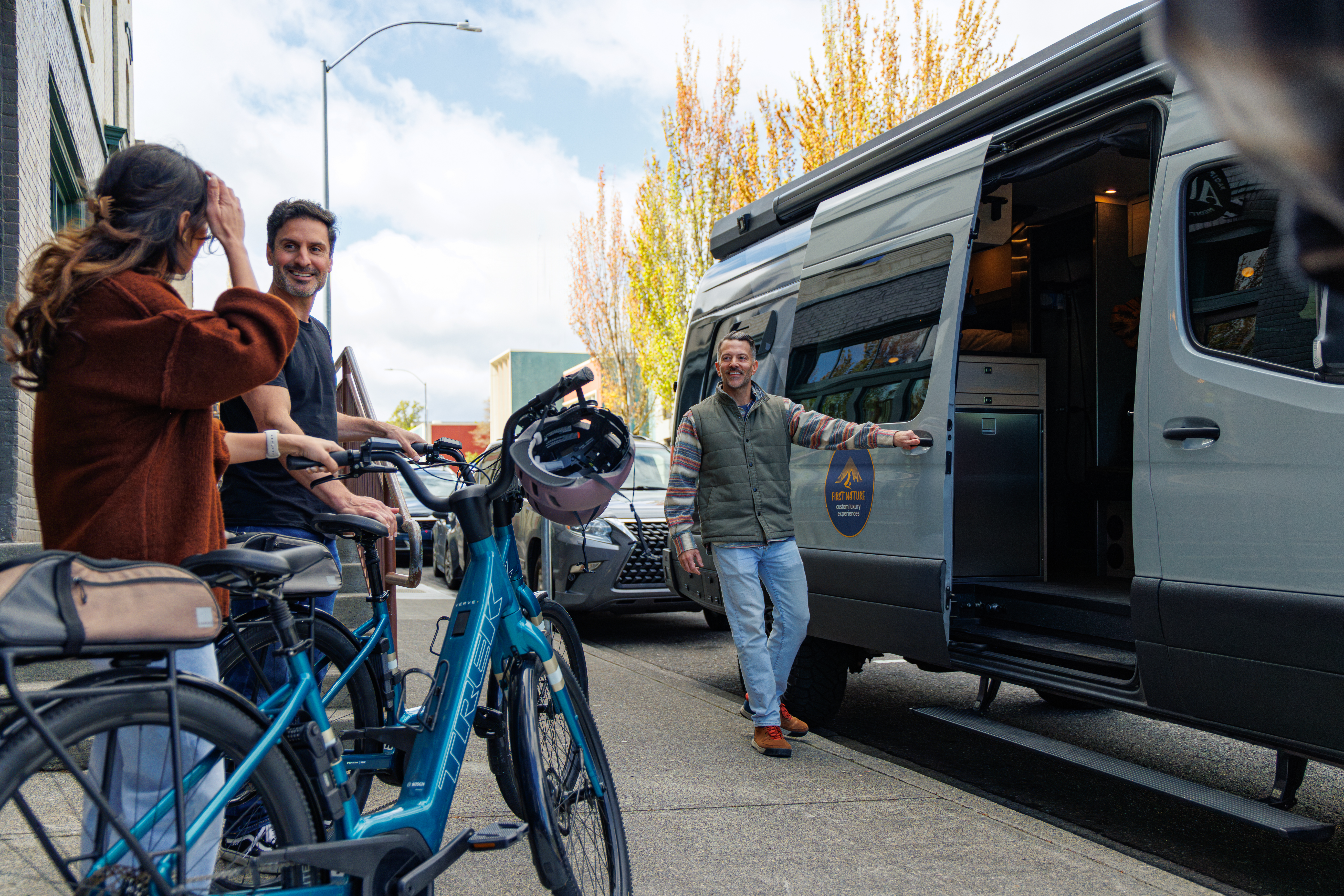 Tour guide preparing bikes and guests for a guided outdoor adventure near Hood River, Oregon.
