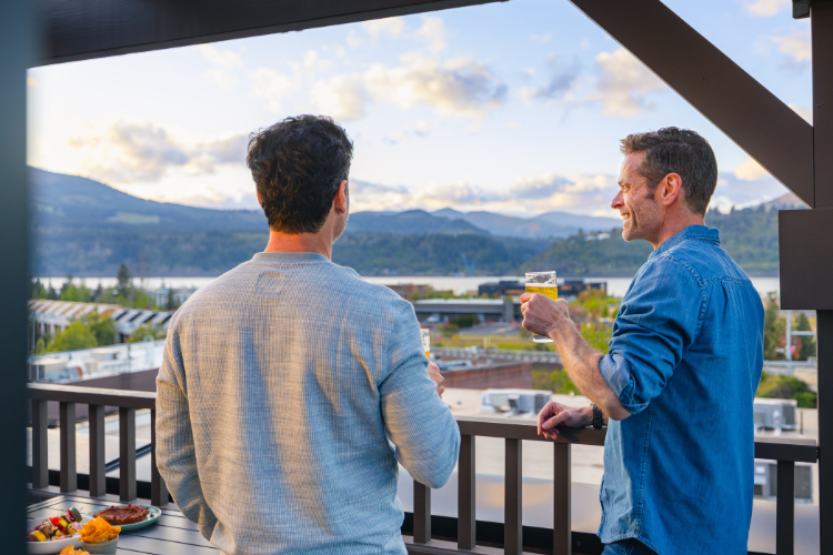 Guests enjoying rooftop drinks overlooking the Columbia River Gorge.