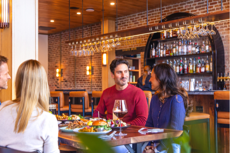 Guests enjoying food and drinks at lobby bar